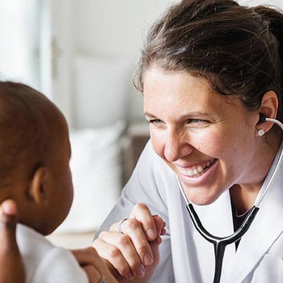 Doctor Smiling At Baby