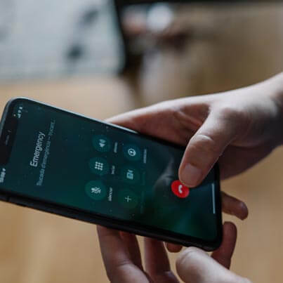 Person Dialing Phone