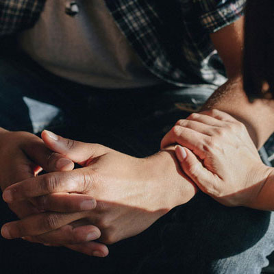 Woman Holding Mans Arm
