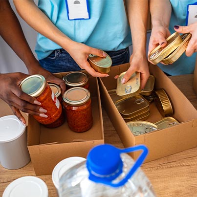 Volunteers Helping In Food Pantry